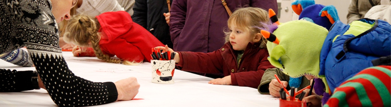 Top down photo of children drawing for mark-making* Heart Felt Tips Christmas campaign