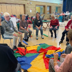 A picture of Anna working with visitors to the Eynsham Day Centre